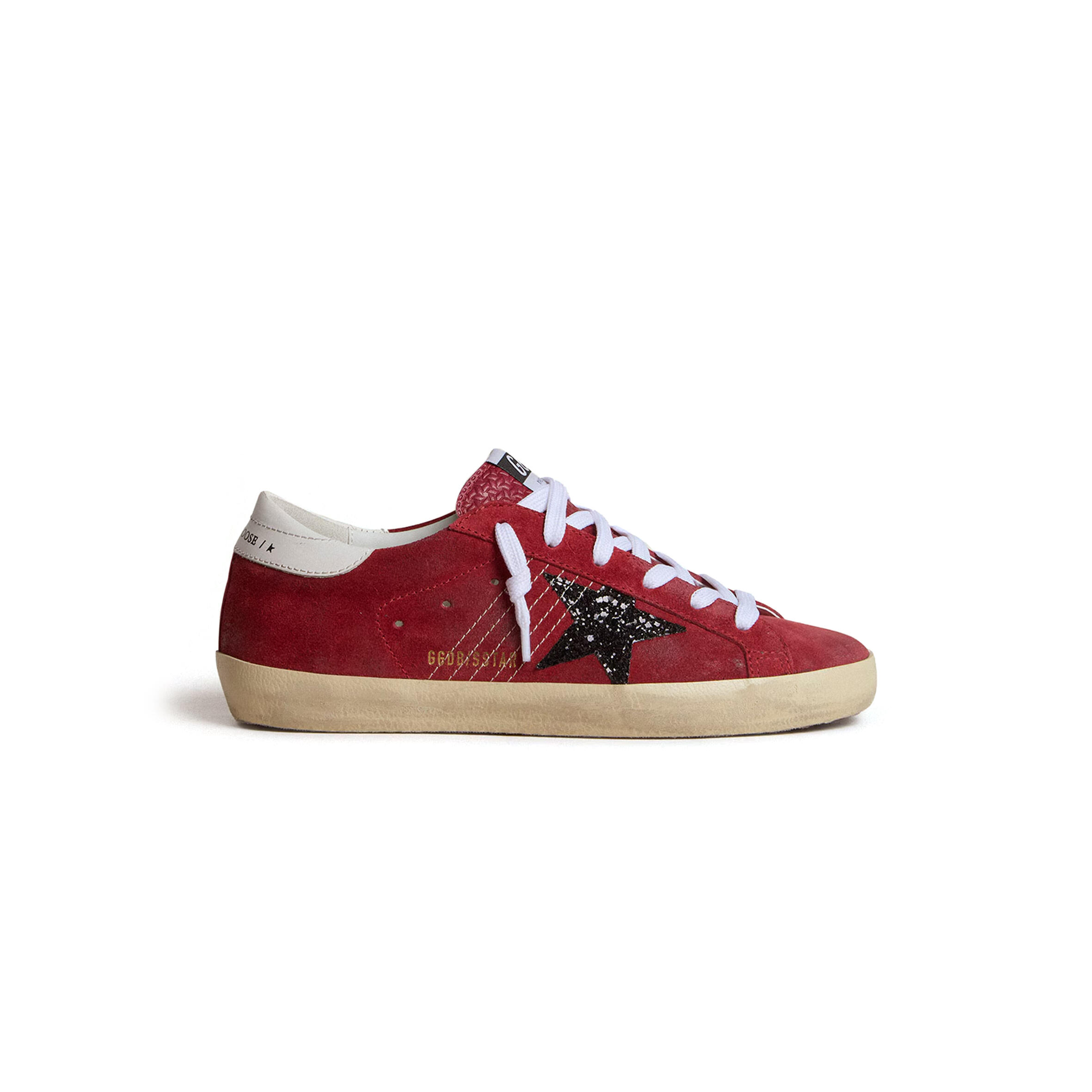 GOLDEN GOOSE WOMEN’S SUPER-STAR IN RED SUEDE WITH GLITTER STAR AND WHITE HEEL TAB GWF00101